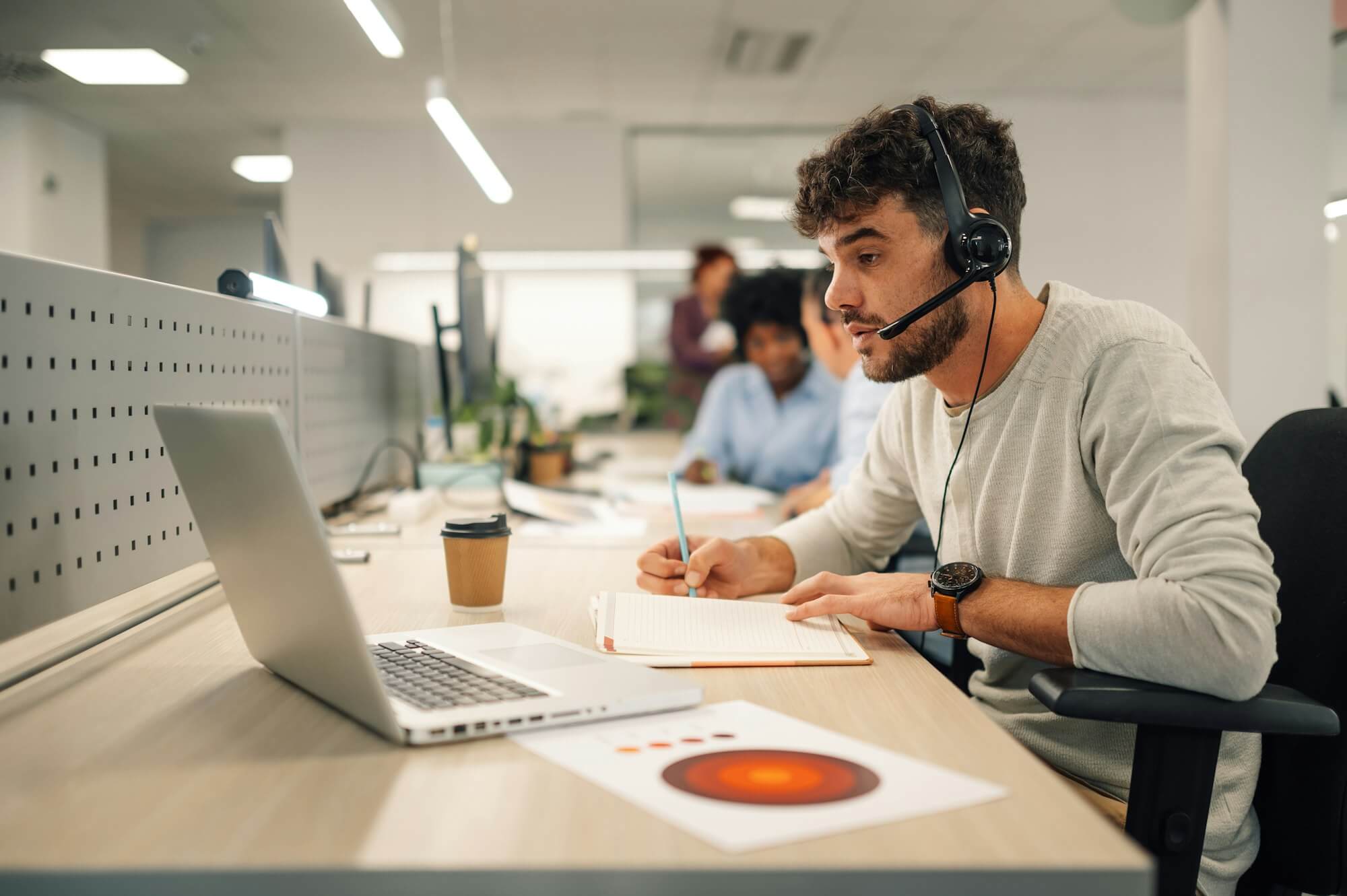 a-virtual-assistant-is-sitting-at-call-center-department-and-working-.jpg